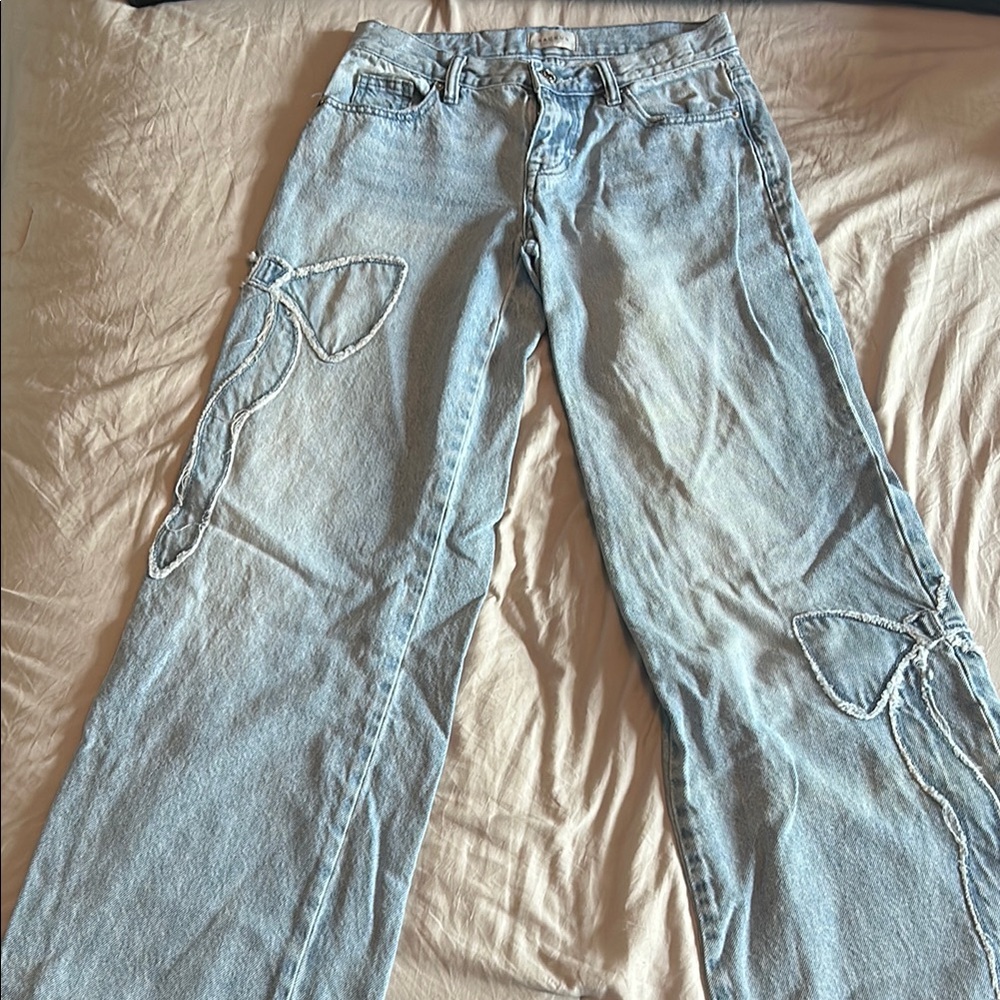 PacSun Blue Flare Wide Leg Jeans with Distressed Detailing and bows